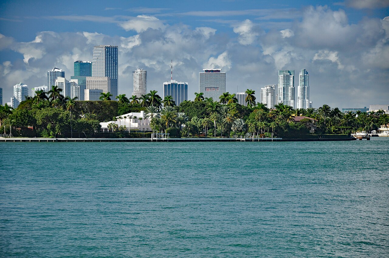 The Miami skyline behind palm-lined Brickell Key across Biscayne Bay
